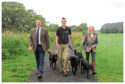 Gordon Douglas, of Second to None Dog Walking, with show president Andrew Turnbull and secretary Jane Drysdale.