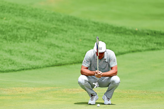 JERSEY CITY, NEW JERSEY - AUGUST 10: Bryson DeChambeau of the United States lines up a putt on the fifth green during the third round of The Northern Trust at Liberty National Golf Club on August 10, 2019 in Jersey City, New Jersey. (Photo by Jared C. Tilton/Getty Images)
