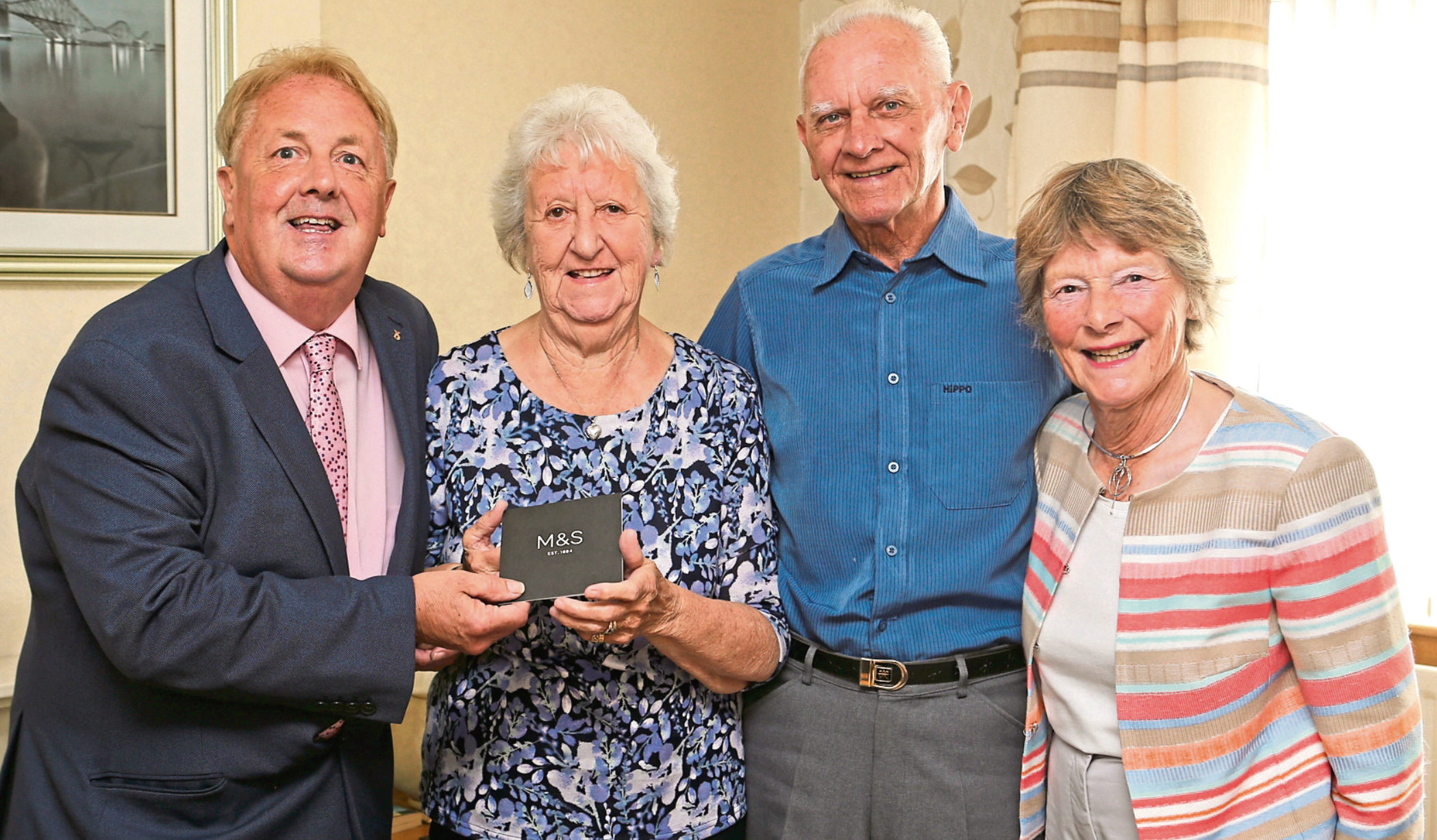 Cllr John OBrien  presented the couple with a gift voucher on behalf of Fife Council and Liz Childs represented the Lieutenancy.
