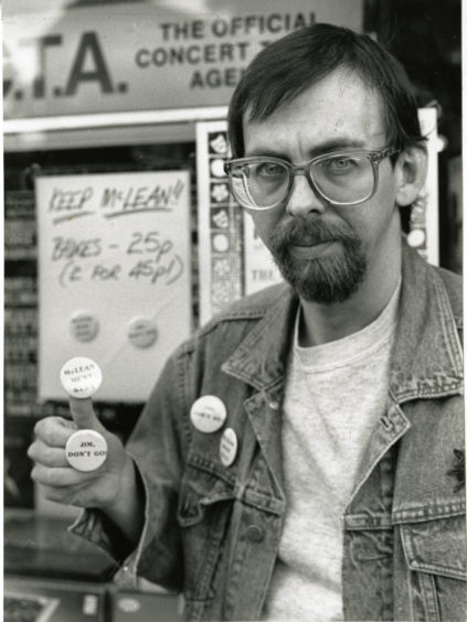 Alastair Brodie, owner of Groucho's Record and Tape Exchange in Marketgait, Dundee, made badges urging Dundee United's then-manager Jim McLean to reconsider his decision to resign. Photo taken in 1988.