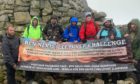 Ross, left, and Steven, right, with their support crew on top of Ben Nevis