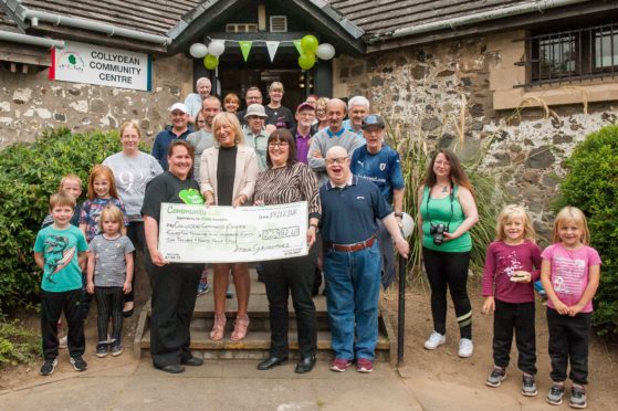 The team at the Collydean Community Cafe celebrate their windfall.