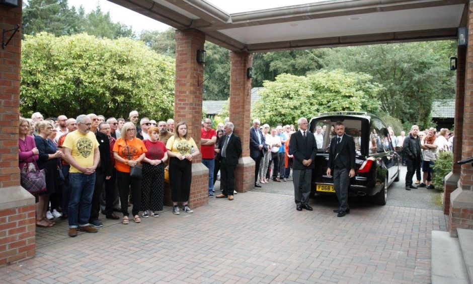 The funeral of Alastair "Breeks" Brodie.