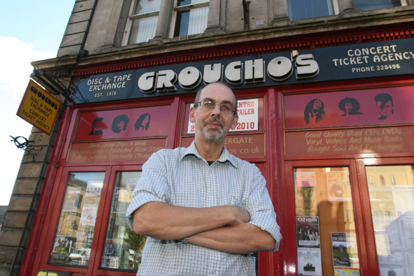 Alastair Brodie stood outside his beloved Groucho's.