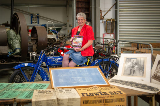 Hilary Farquharson with some of the vintage posters, photographs and books that will be on offer at the sale.
