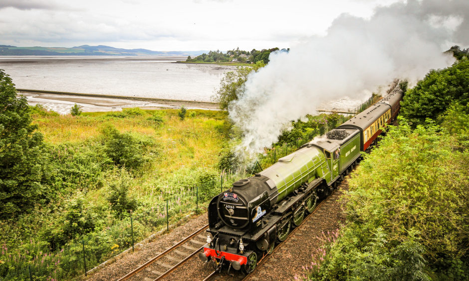 A steam engine travelled through Tayside and Fife on its way to Aberdeen yesterday.
Tornado, owned by the A1 Steam Locomotive Trust, arrived in Invergowrie at around 11.30am having travelled from Edinburgh through Linlithgow and Stirling. The programme, named the Aberdonian, runs again on August 8 and 31, and September 7.
Picture by Kris Miller / DCT Media