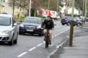 Councillor Kevin Cordell cycling in Dundee.