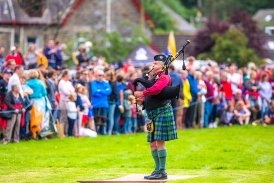 A bagpiper at Killin Highland Games