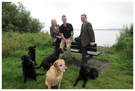 Jane Drysdale, Secretary, Gordon Douglas with his dogs and Andrew Turnbull, President, of the Kinross Show