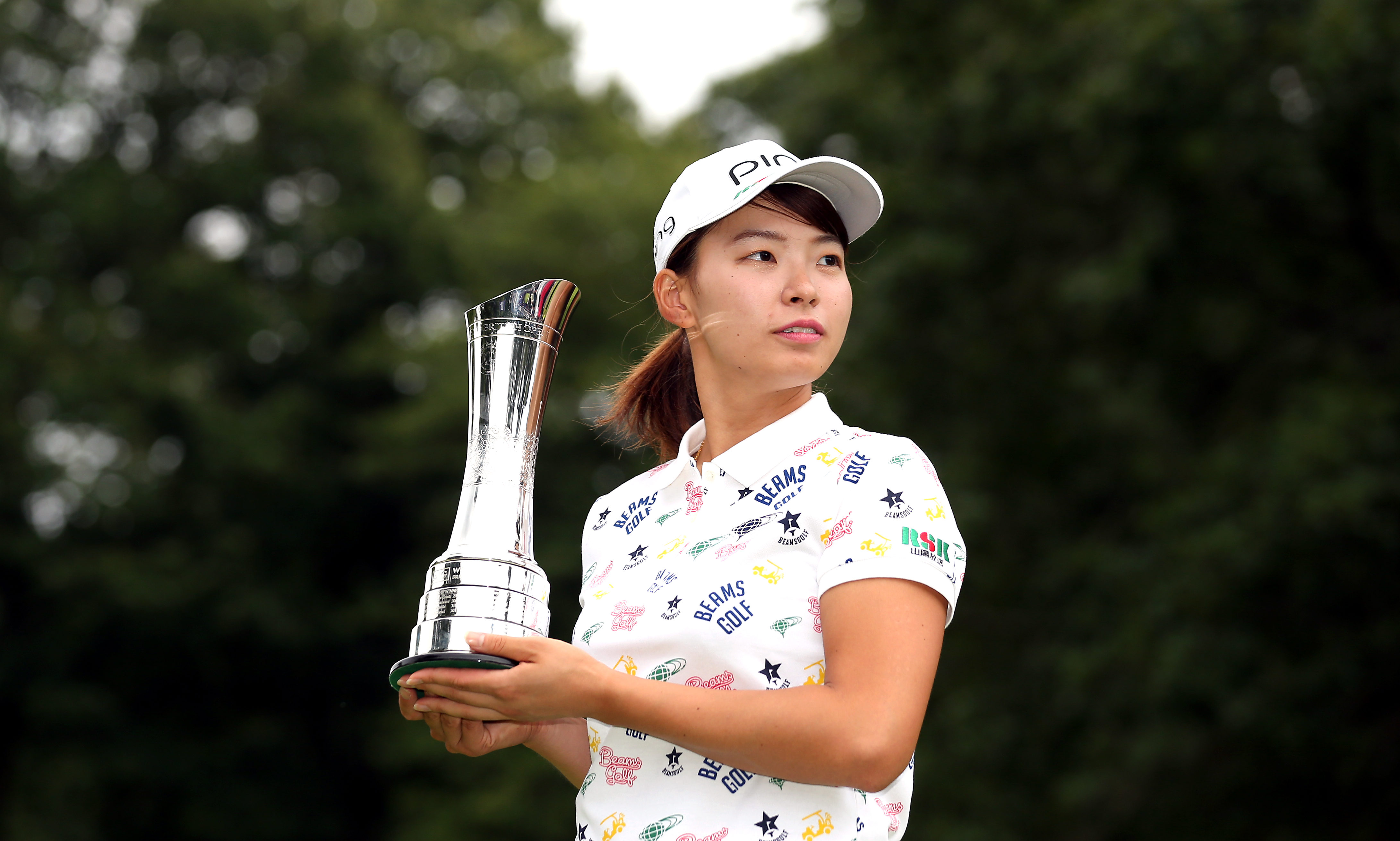 Japan's Hinako Shibuno lifts the trophy for the AIG Women's British Open during day four of the AIG Women's British Open at Woburn Golf Club, Little Brickhill.