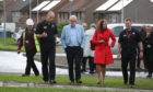 Labour leader Jeremy Corbyn speaks to David McGown, the Deputy Chief Officer of the Scottish Fire and Rescue Service as he arrives to view the fire-damaged Woodmill High School.