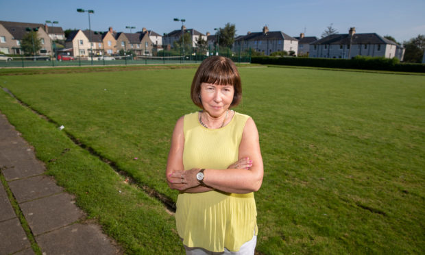 Local resident Tricia Duncan at the green where the sand is to be dumped.