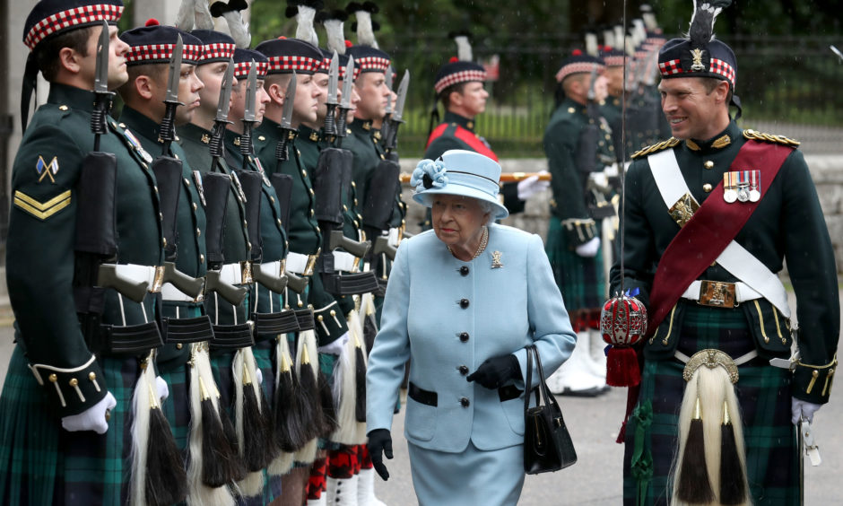 Queen Elizabeth II inspects the Balaklava Company, 5 Battalion The Royal Regiment of Scotland at the gates at Balmoral, as she takes up summer residence at the castle. The Queen met Regimental mascot Cpl Cruachan IV, as well as Pony Major Mark Wilkinson with music by the Pipes and drums 4th Battalion Royal Regiment of Scotland(4SCOTS).