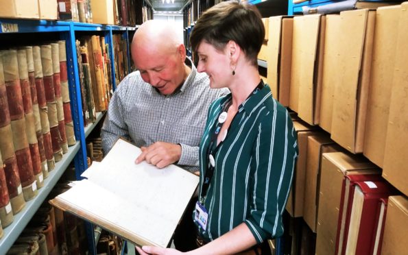 Roben Antoniewicz with assistant archivist Sarah Wilcock