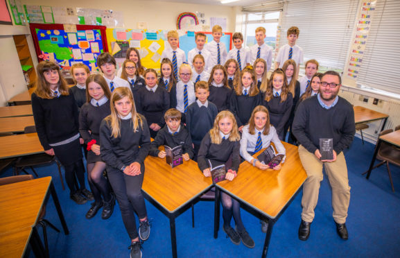 The S2 pupils behind the book publication in aid of WWF. Picture Credit - Steve MacDougall.