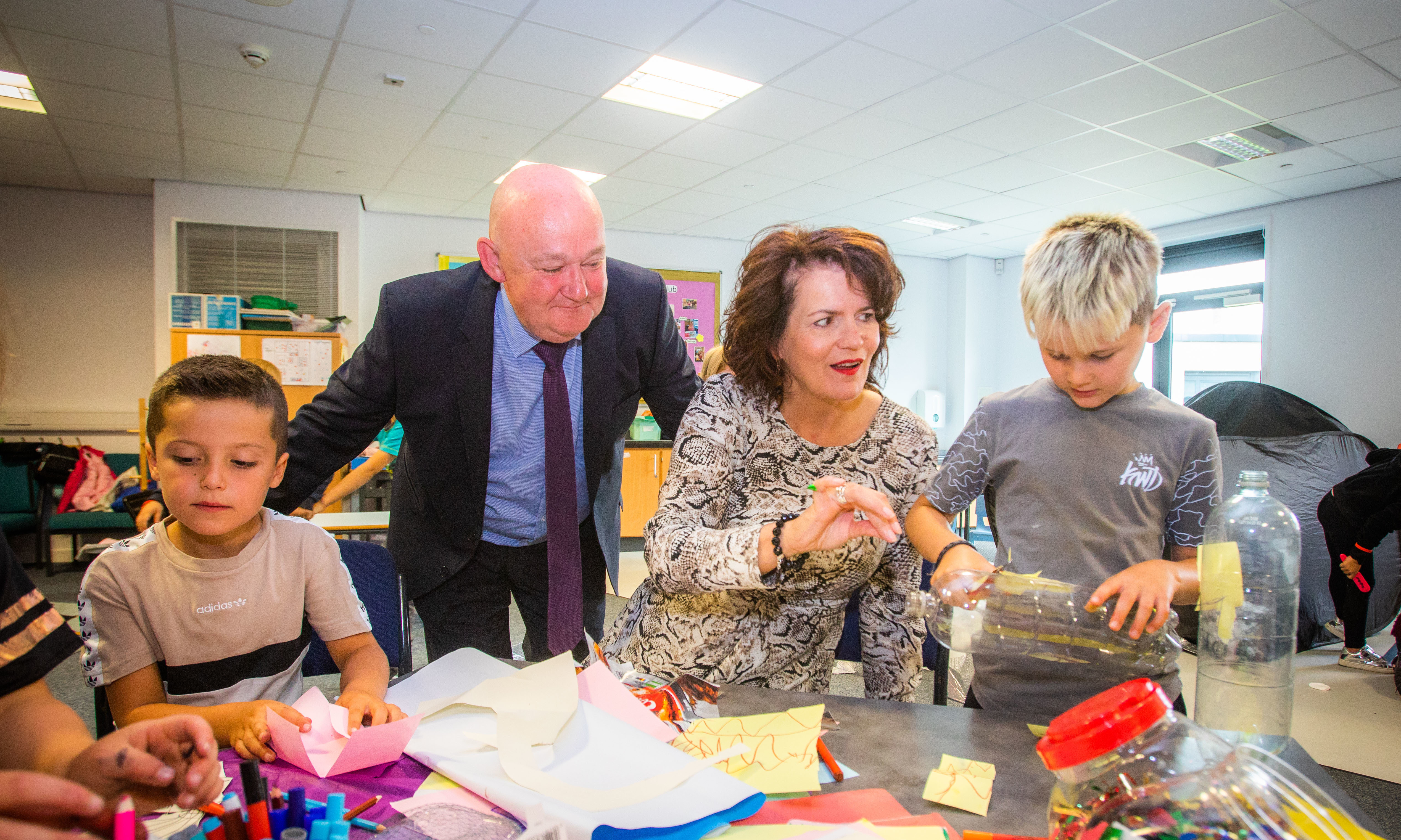 Headteacher of St John's RC Academy Seán Hagney and Perth and Kinross Council's Executive Director for Education and Children's Services Sheena Devlin meet youngsters taking part in the Taste of St John's programme.