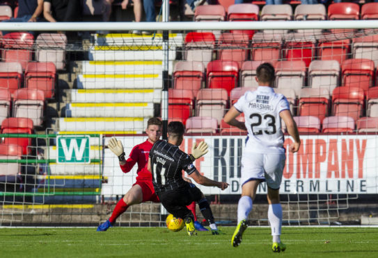 Ryan Dow scores the opening goal.