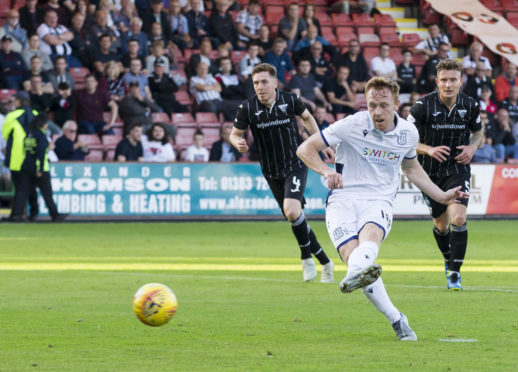 Dundee's Danny Johnson scores from the spot.