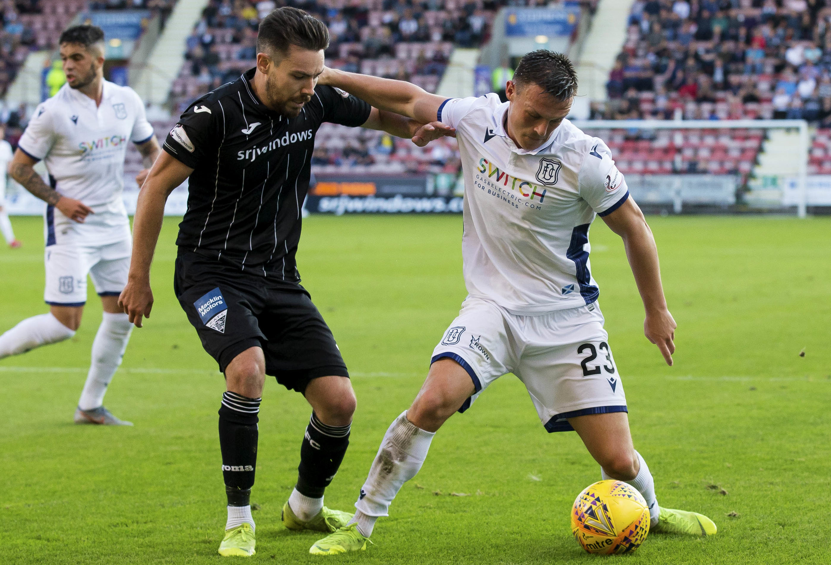 Jordan Marshall, right, holds off Dunfermline player Ryan Dow.