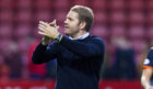 Robbie Neilson applauds the United fans at Firhill.