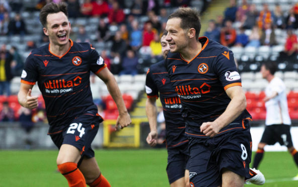 Lawrence Shankland helps Peter Pawlett celebrate his goal.