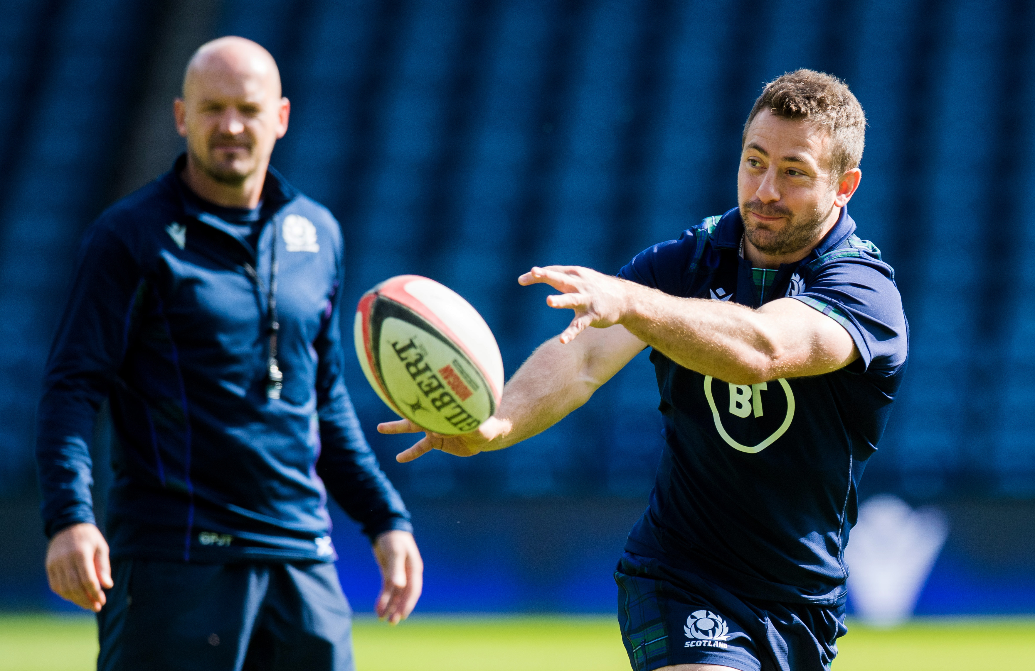 Greig Laidlaw leads the captain's run at Murrayfield under the watchful eye of head coach Gregor Townsend.