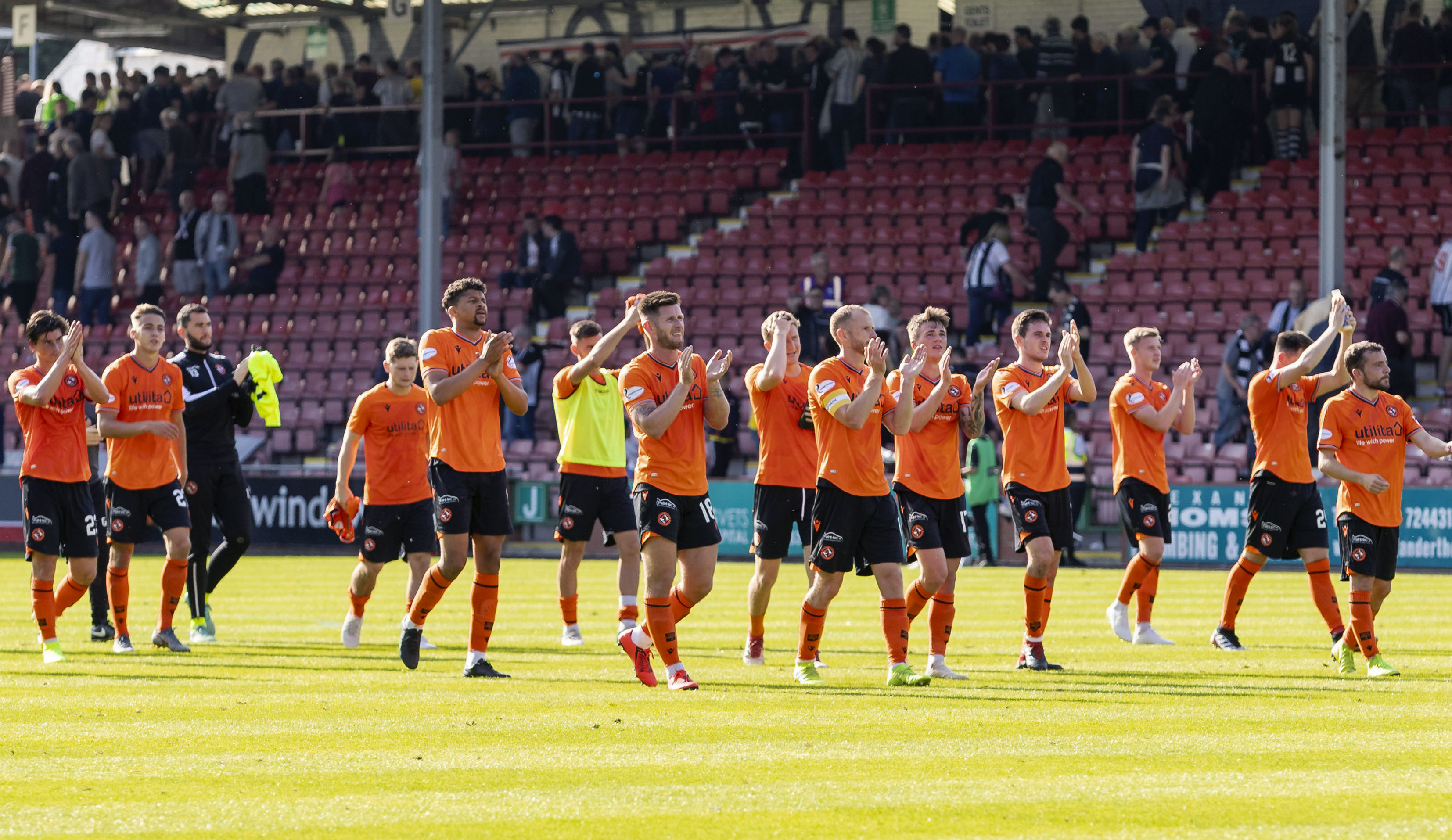 The United players applaud their fans after the win at Dunfermline.