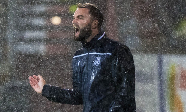 Pain in the rain for James McPake at Tannadice during the August derby.