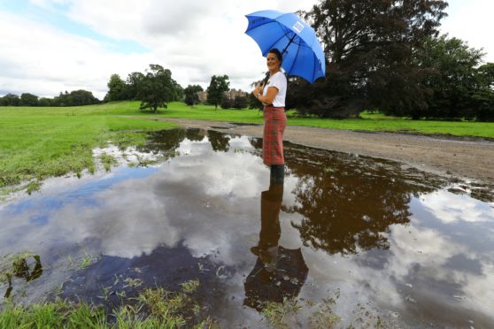 Scone Palace Retail Assistant, Lee Trussell braving a large puddle,