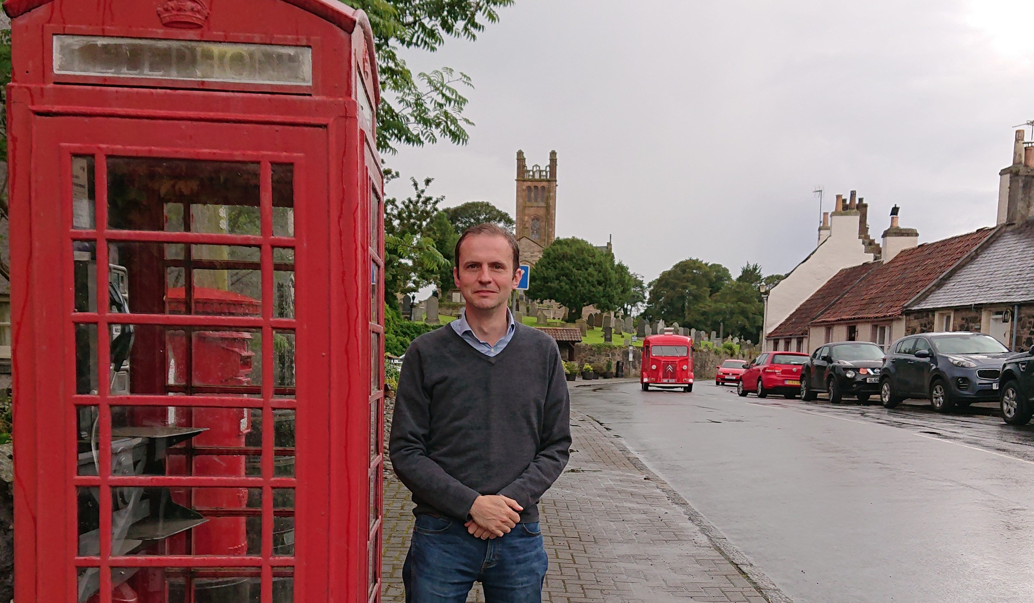 Stephen Gethins outside the phone box in Kilconquhar.