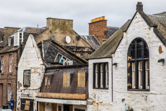 The collapsing White Horse Hotel building