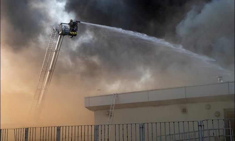 Firefighters tackling the 
blaze at Woodmill High School.