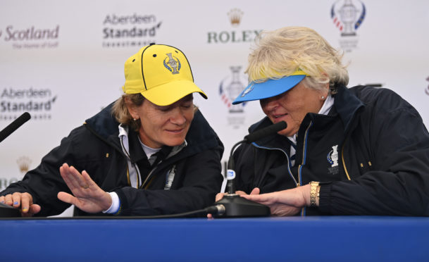 Solheim Cup captain Catriona Matthew and assistant Dame Laura Davies compare nail art at Gleneagles.
