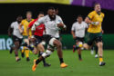 Waisea Nayacalevu runs in his side's second try during the Rugby World Cup match with Australia.