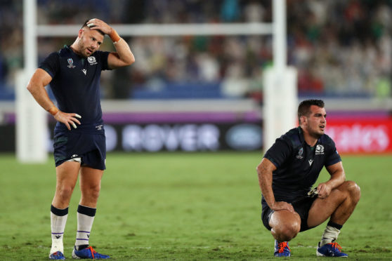 Ali Price and Stuart McInally at the end of the opening Rugby World Cup game against Ireland.