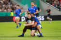 Greig Laidlaw breaks through Ed Fidow's tackle for Scotland's second try.