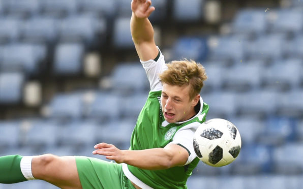 Sean Mackie in action for Hibs.