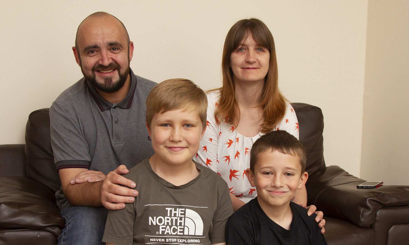 Aiden Marshall, 11 (left) pictured at home in Montrose with his mum Theresa, Dad Jon and brother Callum,(10).