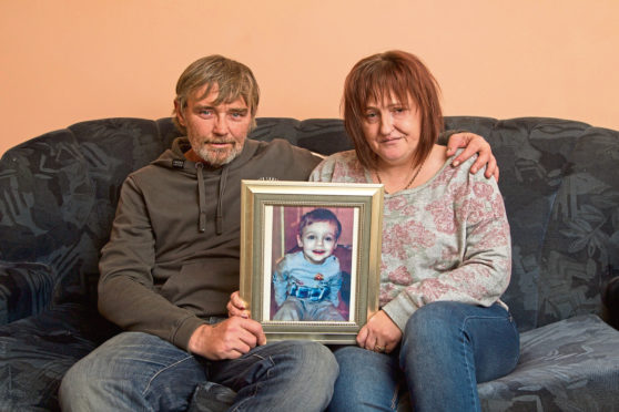 Wayne Forte and Leanne Smith with a photo of their son. Leanne has since passed away.