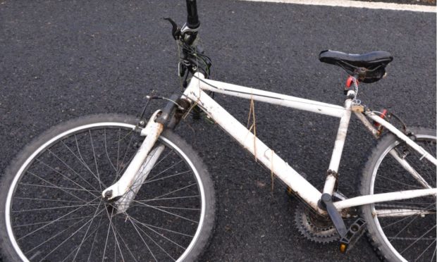 A picture of the white mountain bike involved has been released.