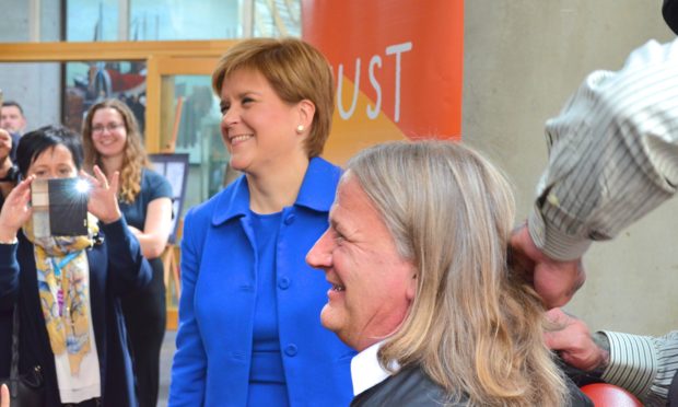 David Torrance MSP getting his hair cut for charity.