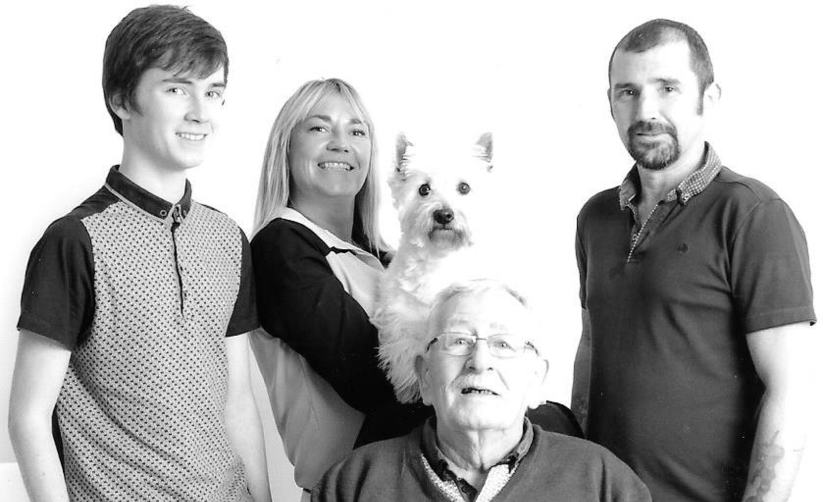 Most recent family image of Stewart's grandson James, Jeanie holding Blue the dog, Jeanie's partner Anthony and Stewart.