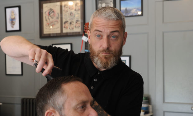 Barber Brian Jobson at his barber shop in Dunfermline.