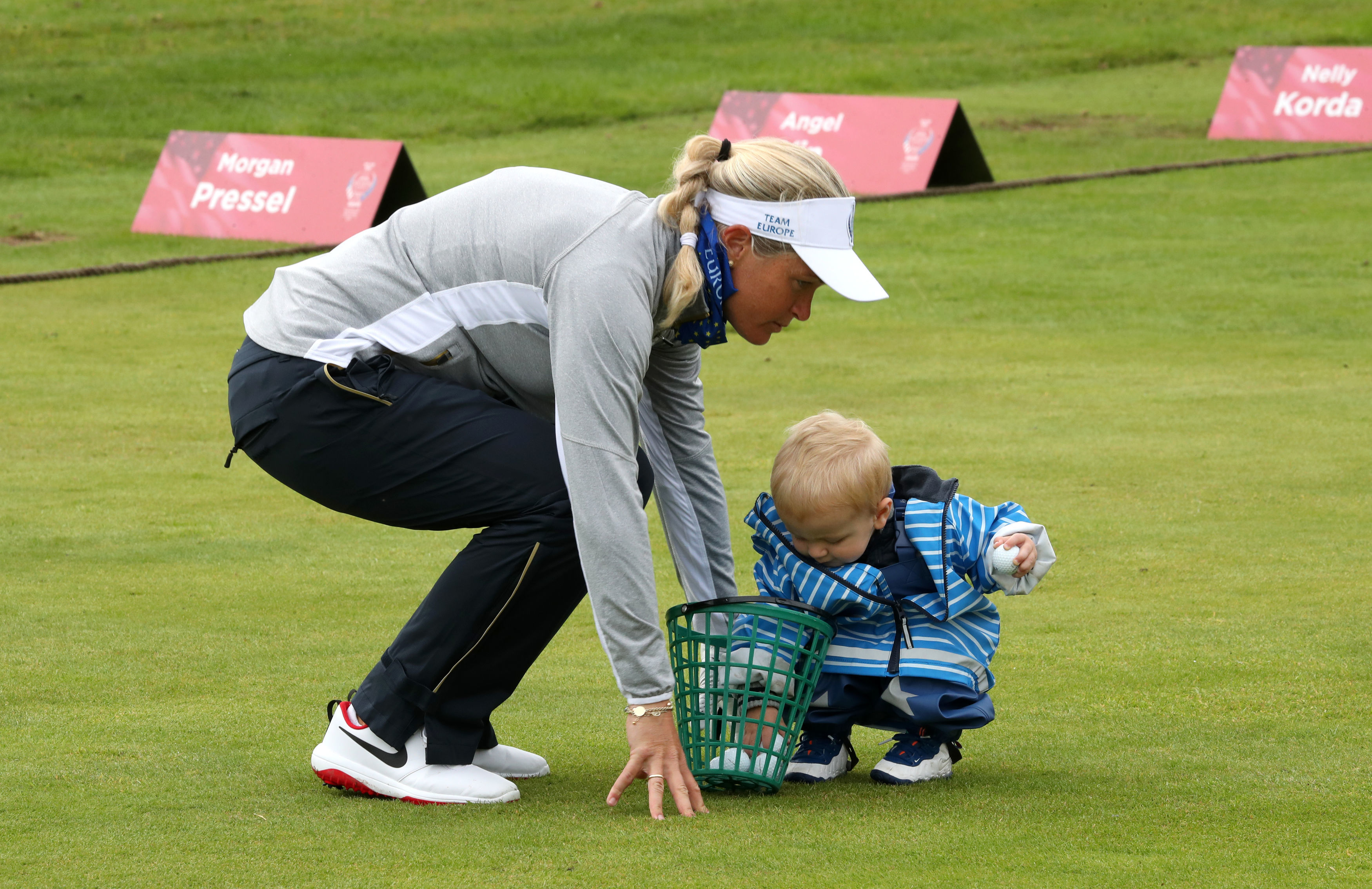 Suzann Pettersen with her son Herman on the driving range at Gleneagles.