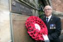 Wreaths were laid for Pte John Ferguson, including by RAF Sergeant John Flynn (pictured).