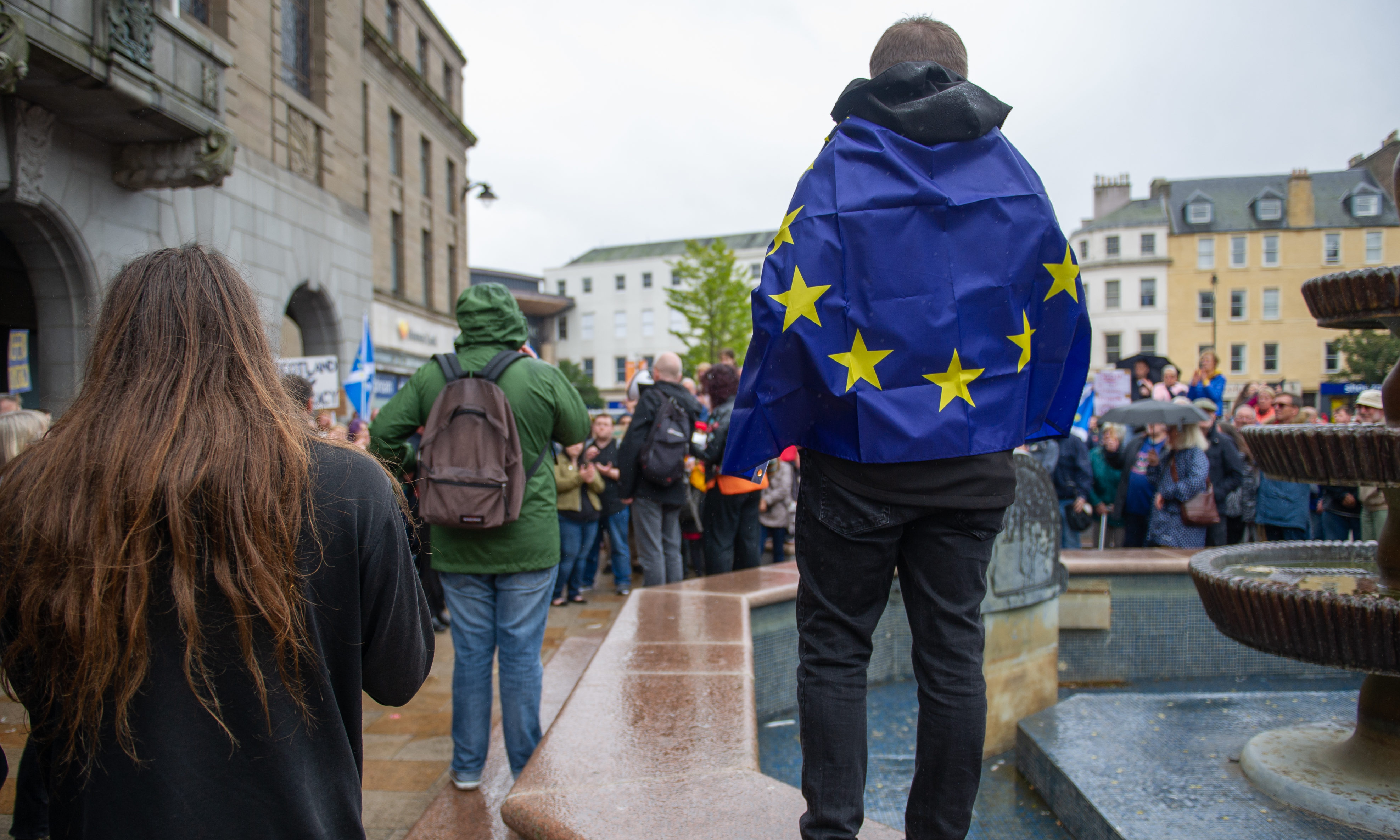 A protester wrapped in a Brexit flag outside Dundee City Chambers in September 2019.