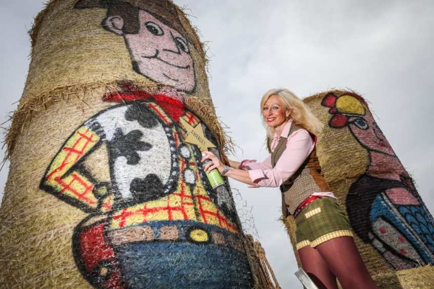 Fleur Baxter with a preview straw bale creation- Toy Story's Woody.
