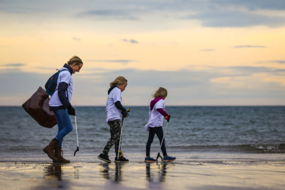 Pauline Allison with David and Anna Peebles on Carnoustie beach.