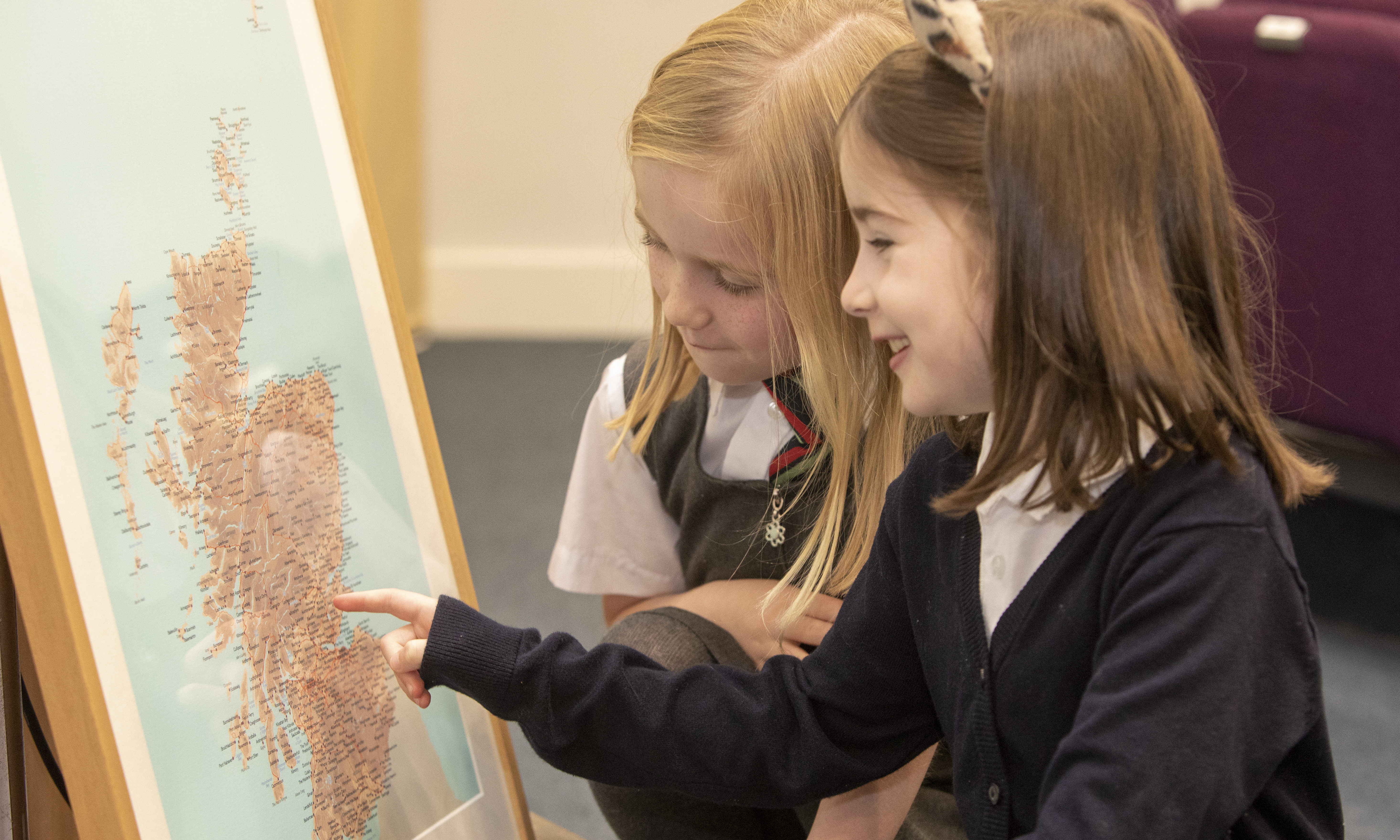 Pupils from RDM Primary School get acquainted with the map.