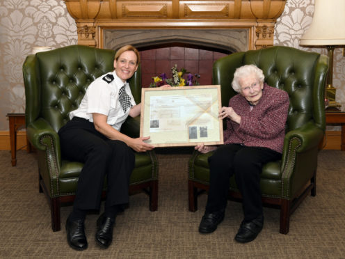 ACC Angela McLaren presented Minnie Clark with her police record.